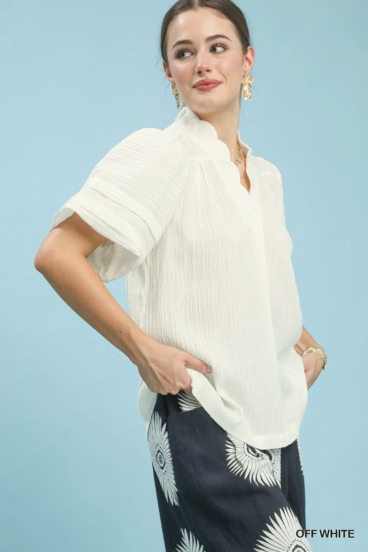 This Seersucker Scalloped V-Neck Top